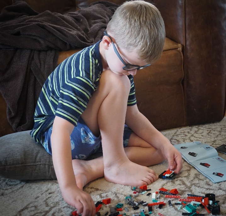 boy building with Legos